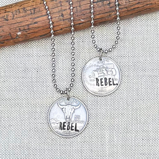 REBEL.- For the one becoming bold enough to live truthfully—even when it breaks the mold.